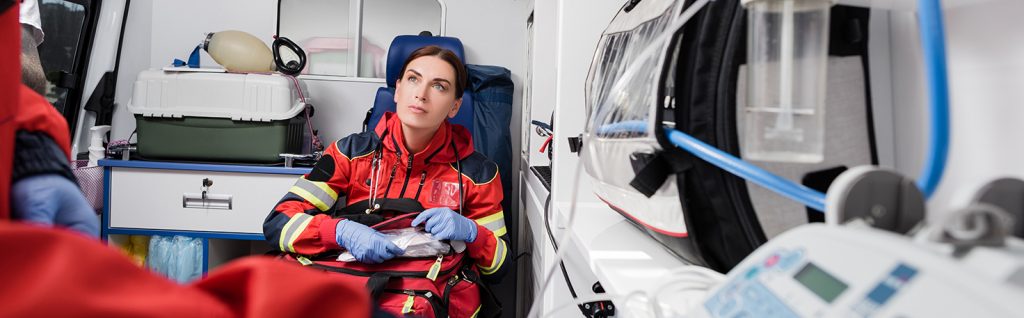 Paramedic in Patient Compartment in Ambulance